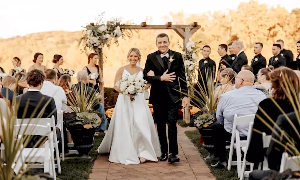 Bride and groom walk back down aisle after their Ballyowen Wedding Garden fall ceremony.