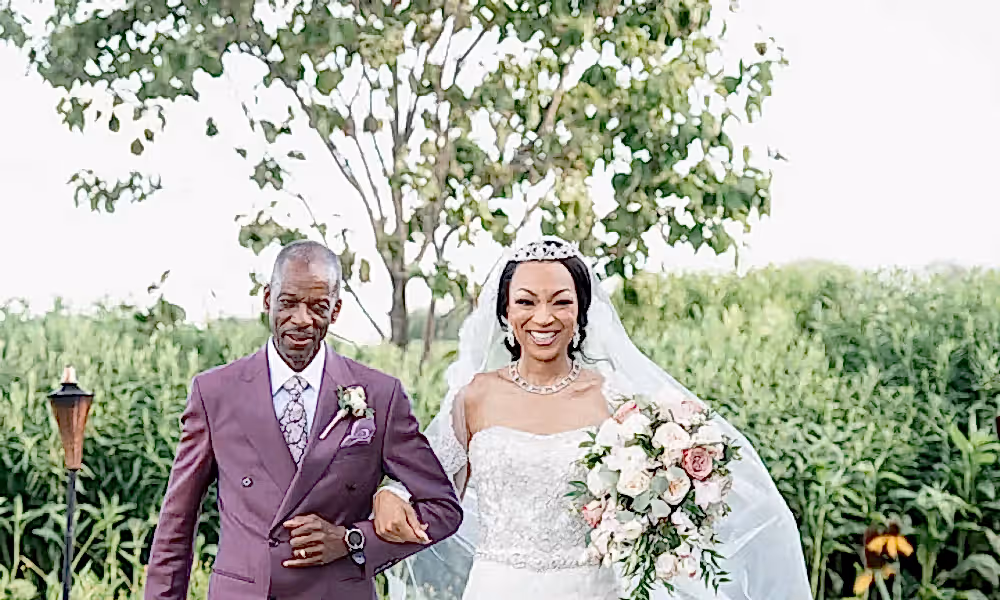 Bride walks down aisle with father during ceremony at Ballyowen Wedding Garden.