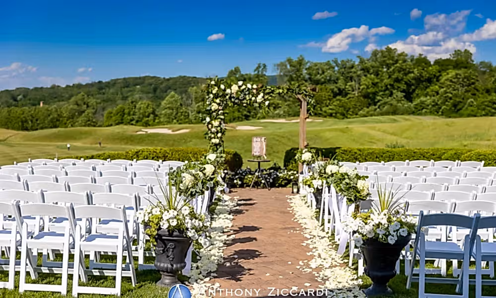 Ballyowen Wedding Garden ceremony featuring white chairs and floral arch.