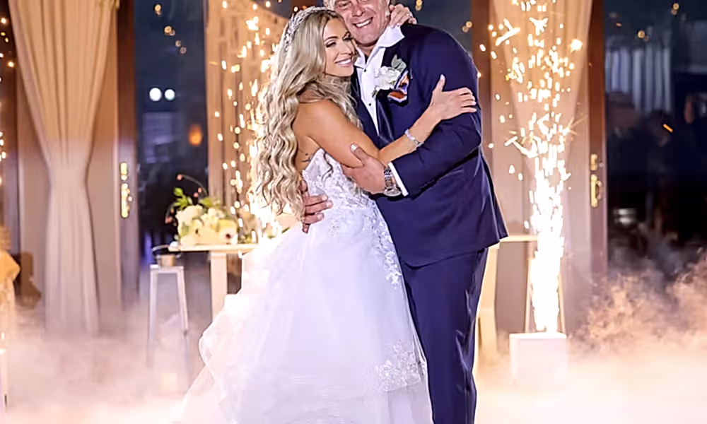 Couple hugging as they stand in fog on the dance floor during their Bailigh Bluff House wedding reception.