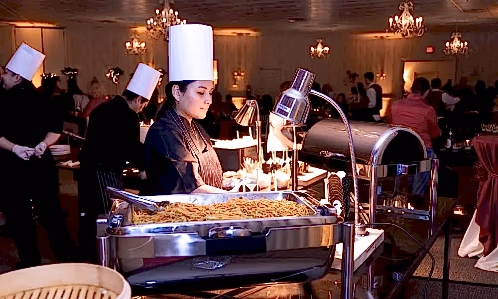 Chef distributing food in Diamond Cocktail Room. 