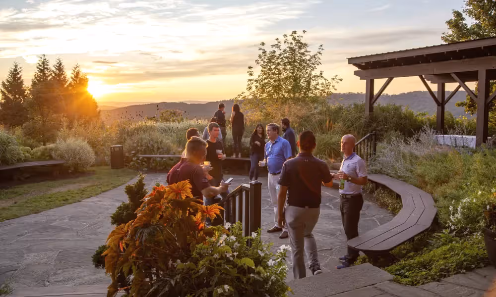 Corporate gathering in the Garden Patio during sunset. 