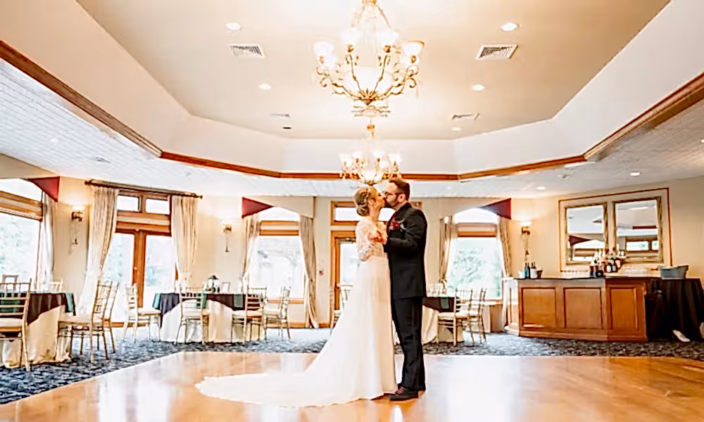 Bride and groom kiss on the dance floor at Black Bear wedding.