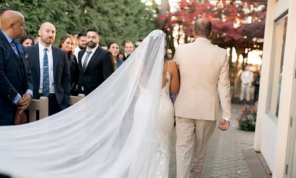 Man and bride walk down aisle at Black Bear wedding ceremony. 