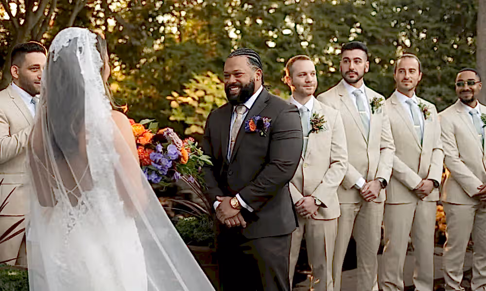 Groom and bride stand together at altar at Black Bear wedding ceremony.