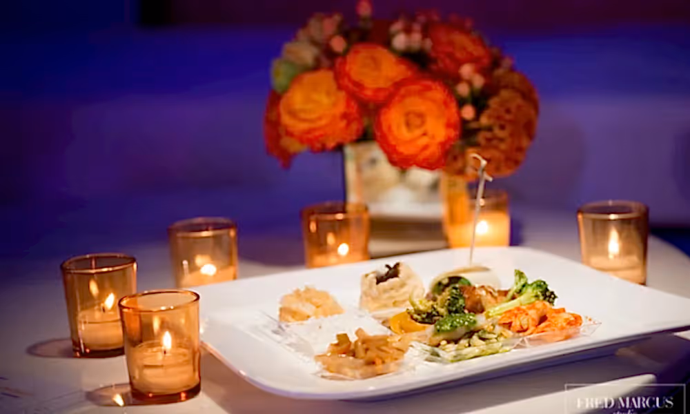 Small hors d'oeuvres plate surrounded by candles