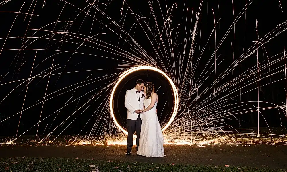 Bride and groom in the circle of sparklers