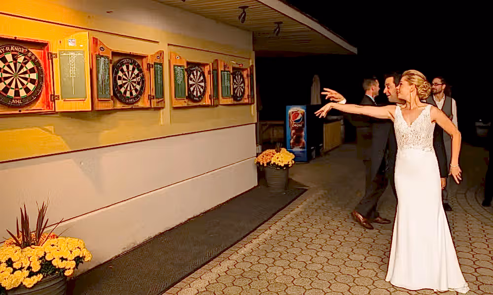 Bride playing darts