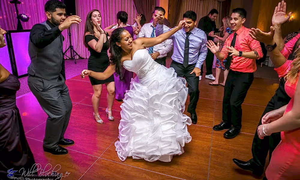 Bride dancing with wedding guests
