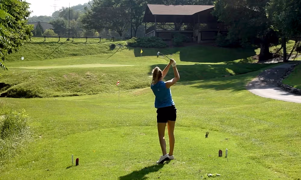 Woman on a golf course at a resort close to NYC