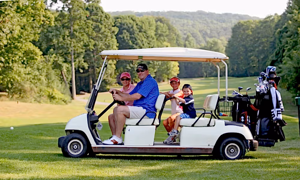 Parents with their kids on a family friendly golf course at Crystal Springs Resort in New Jersey.