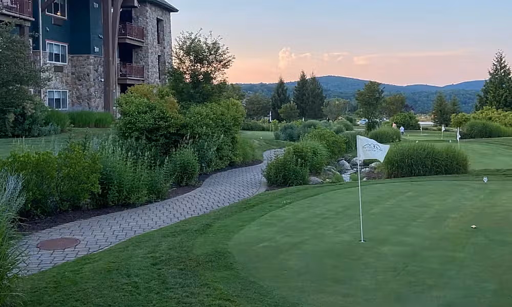 The putting green course at Grand Cascades Lodge at sunset