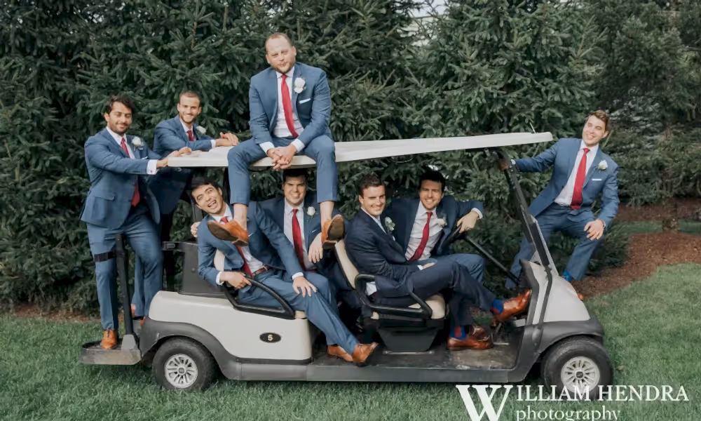 Groomsmen piled onto golf cart