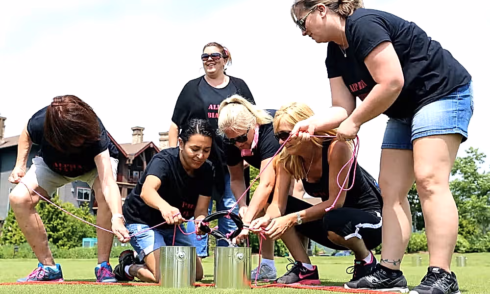 A group working together to complete a teambuilding activity
