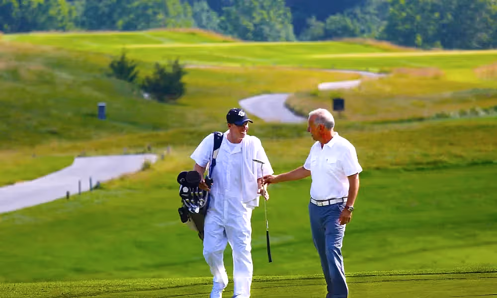 Golfer and Caddy on the course of Ballyowen at Crystal Springs Resort