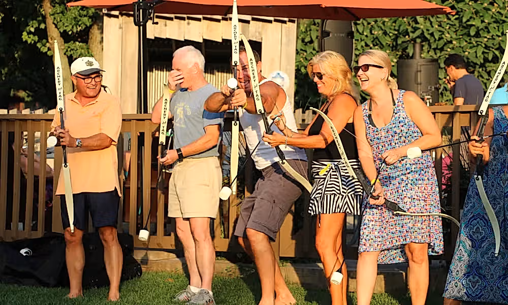 Adults enjoying a teambuilding activity with Archery Tag