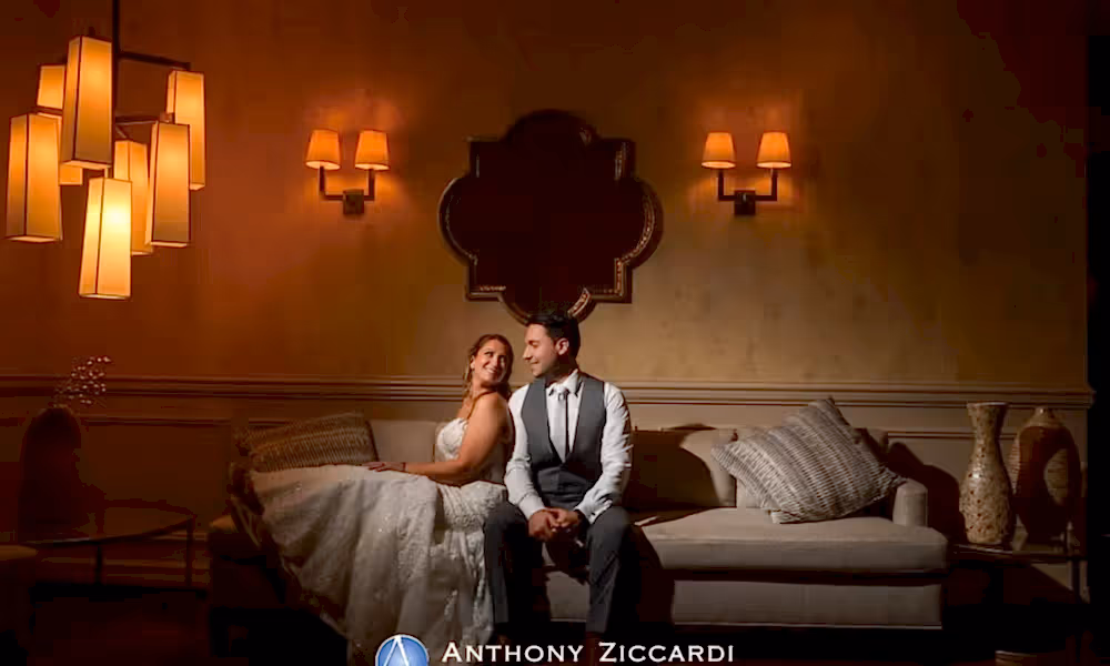 Bride and Groom sitting on couch