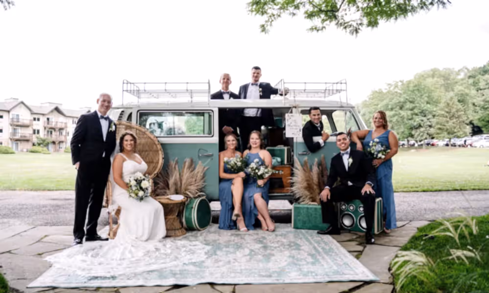 Wedding party sitting in green VW van