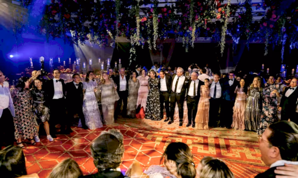 People standing around dance floor at Big Sky Pavillion.