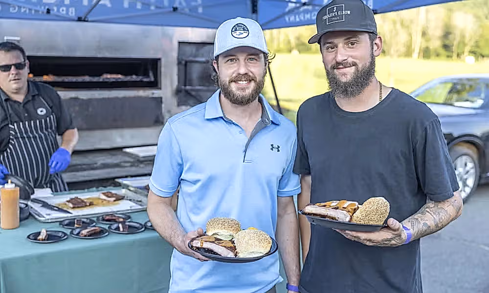Two men with plates of food. 