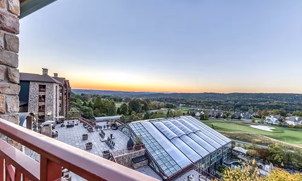 Sunset mountain view from Grand Cascades Lodge balcony.