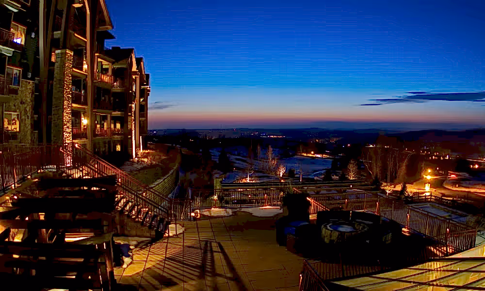 Nightime shot of fire and water terrace at Grand Cascades Lodge. 