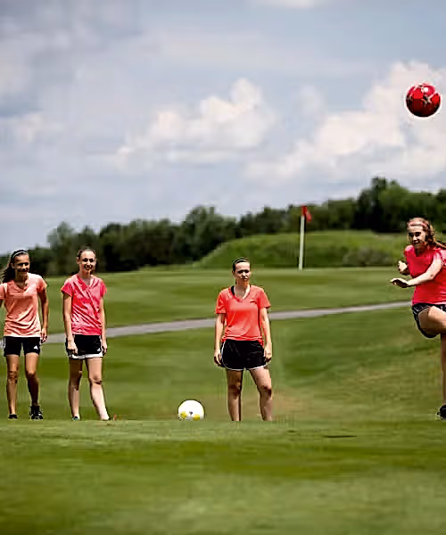 Four girls playing foot golf at Crystal Springs Resort