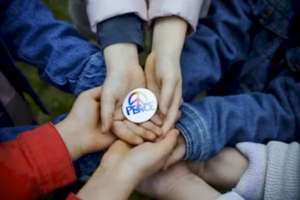 Hands holding a rock. 