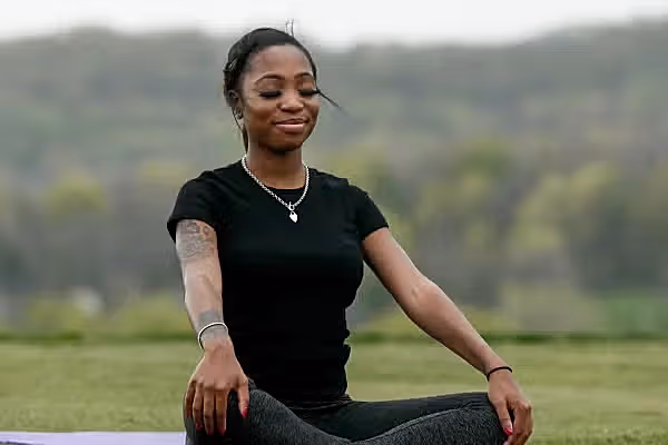 yoga and mediation outside on grass