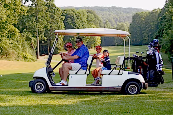 Parents with their kids on a family friendly golf course at Crystal Springs Resort in New Jersey.