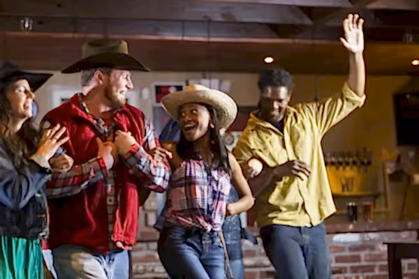 Group of people line dancing. 