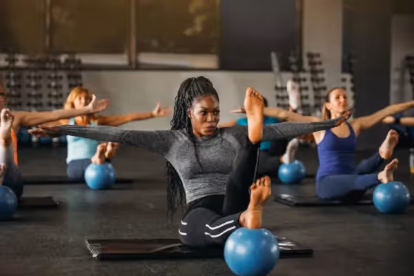 Group of women taking workout class.