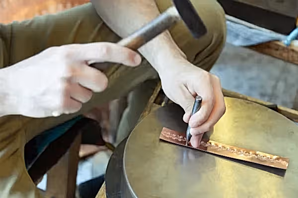 Person metal stamping.