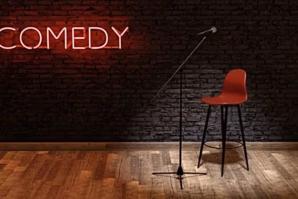 Microphone and chair on stage.