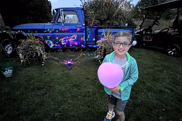 Child with glow cotton candy at Crystal Springs Resort.