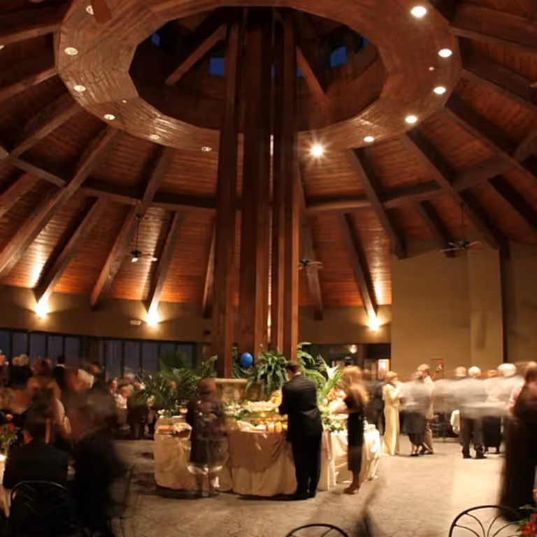 Guests dressed formal for an evening event in the Rotunda at Crystal Springs Resort