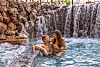 Couple enjoying drinks in the jacuzzi