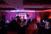 Man on Crystal Cabaret stage playing a violin.